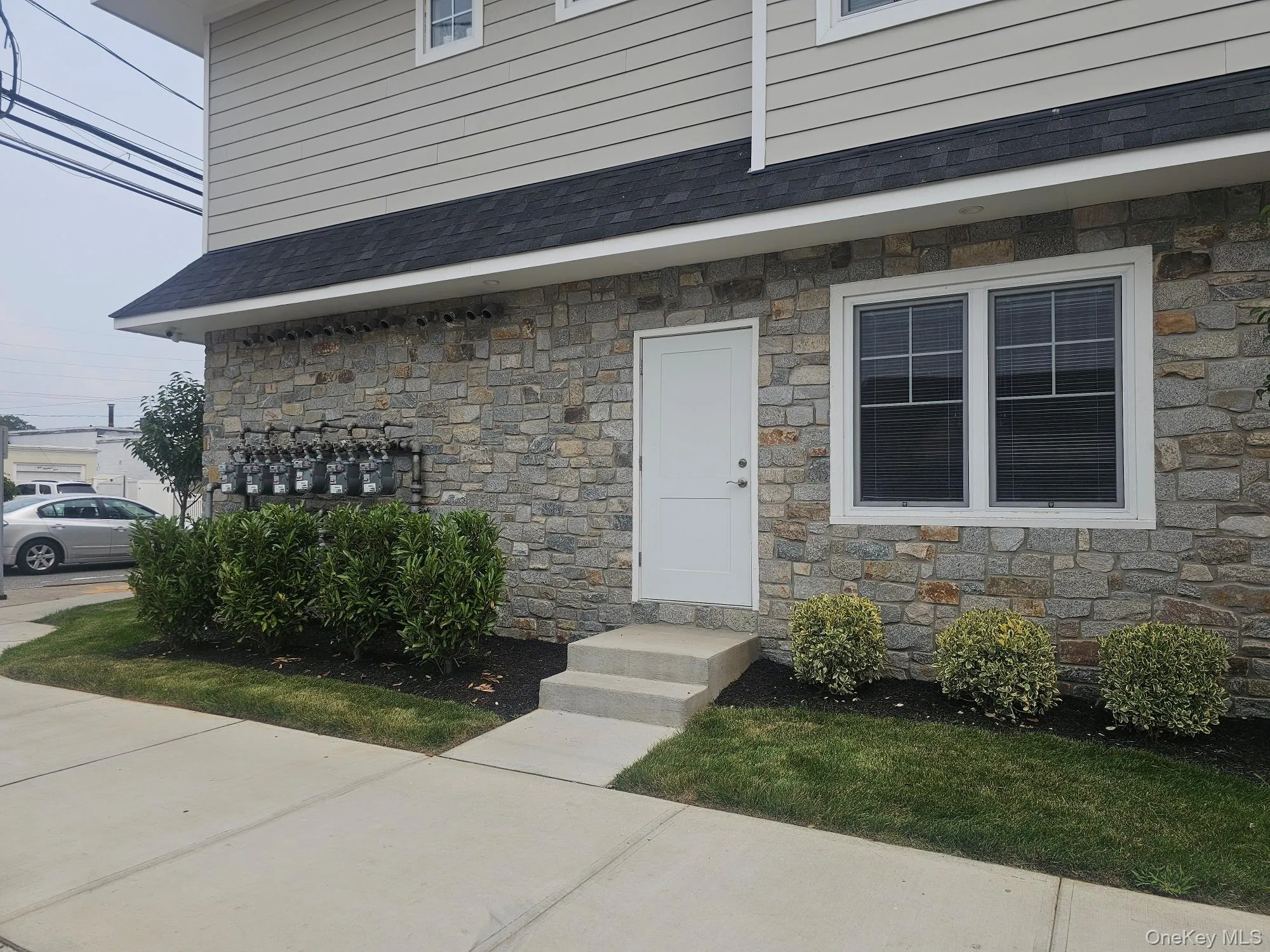 Property entrance featuring stone siding Property entrance featuring stone siding