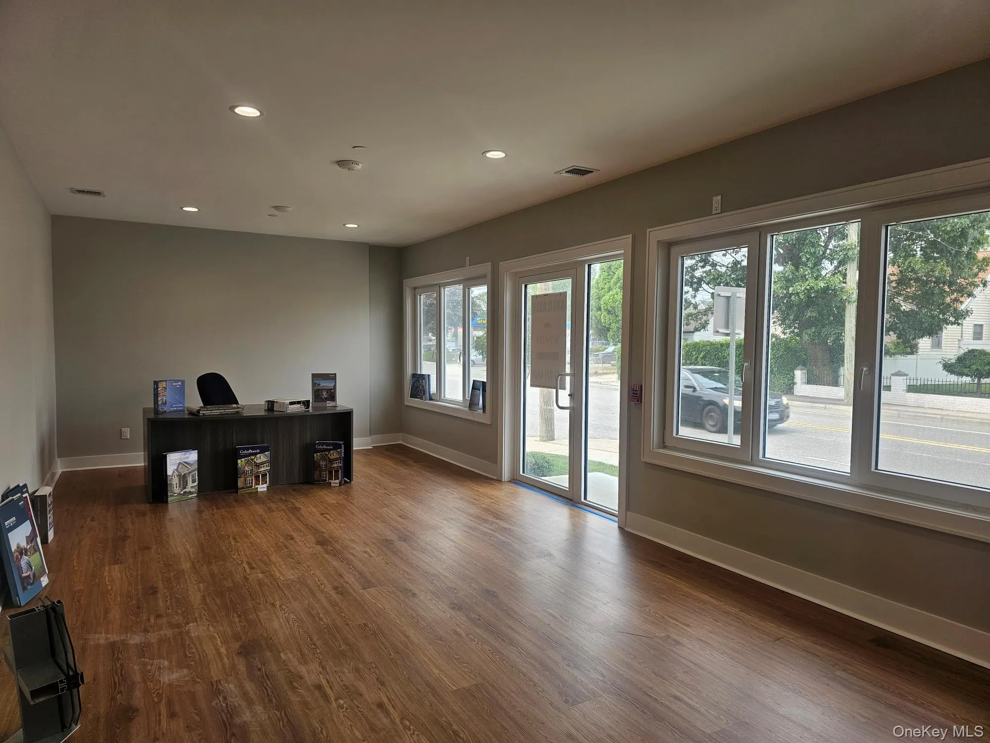 Unfurnished office with recessed lighting and dark wood finished floors Unfurnished office with recessed lighting and dark wood finished floors