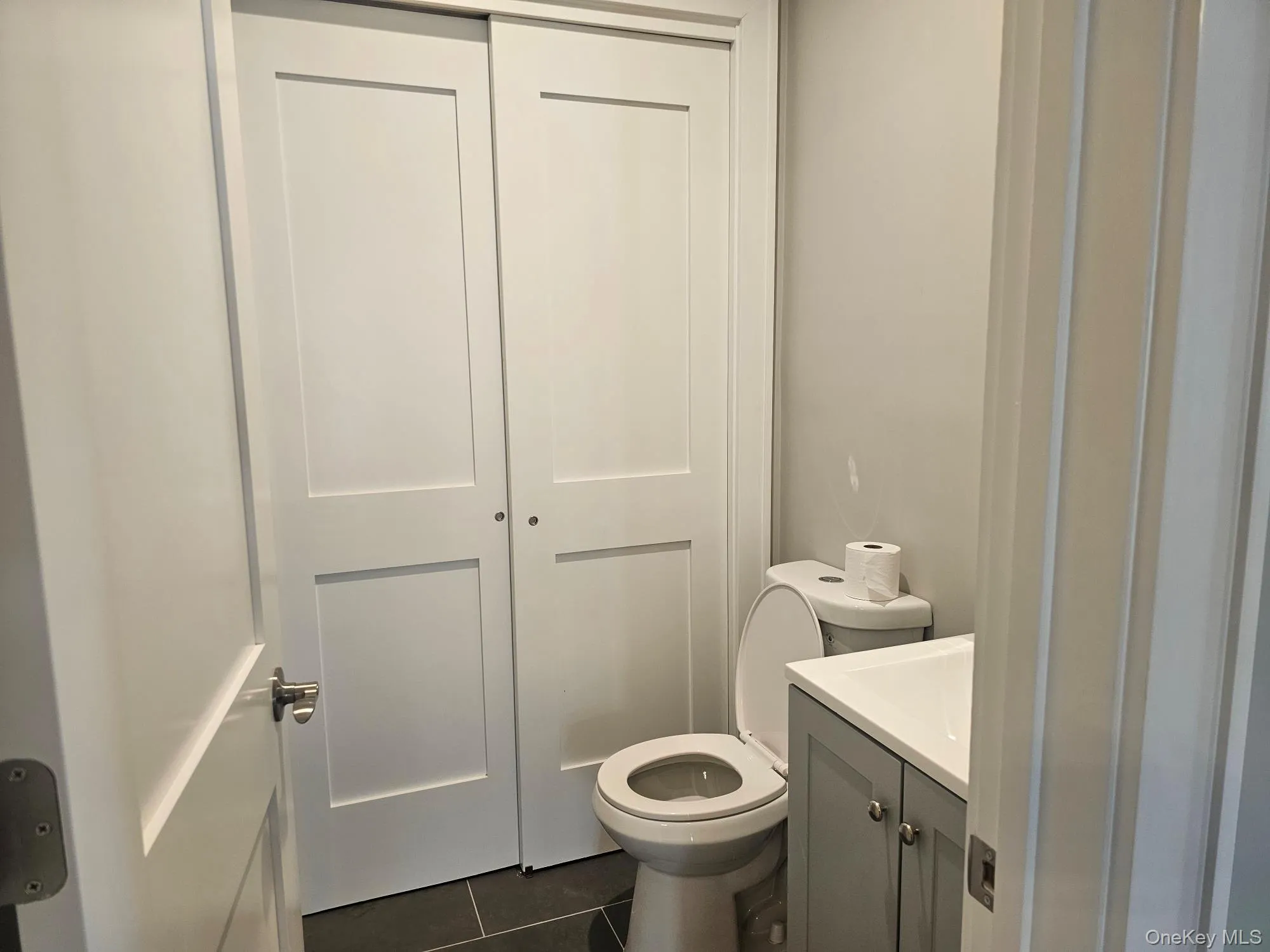 Bathroom with tile patterned floors and vanity Bathroom with tile patterned floors and vanity