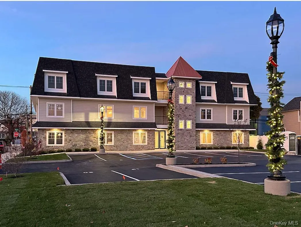 View of property featuring uncovered parking View of property featuring uncovered parking