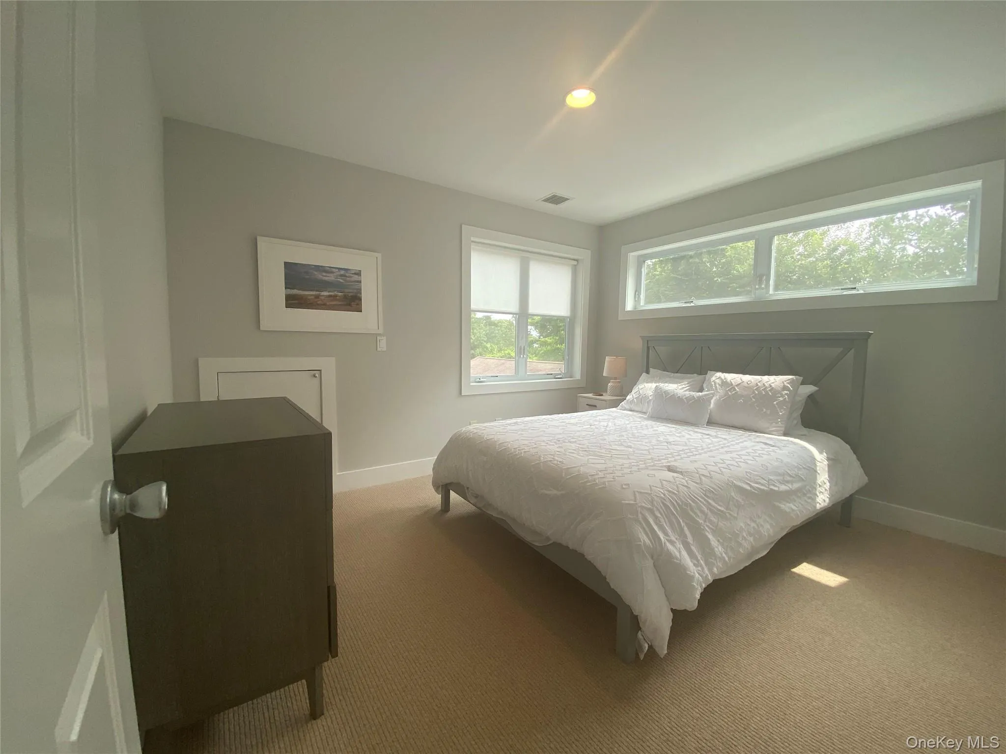 Carpeted bedroom with baseboards Carpeted bedroom with baseboards