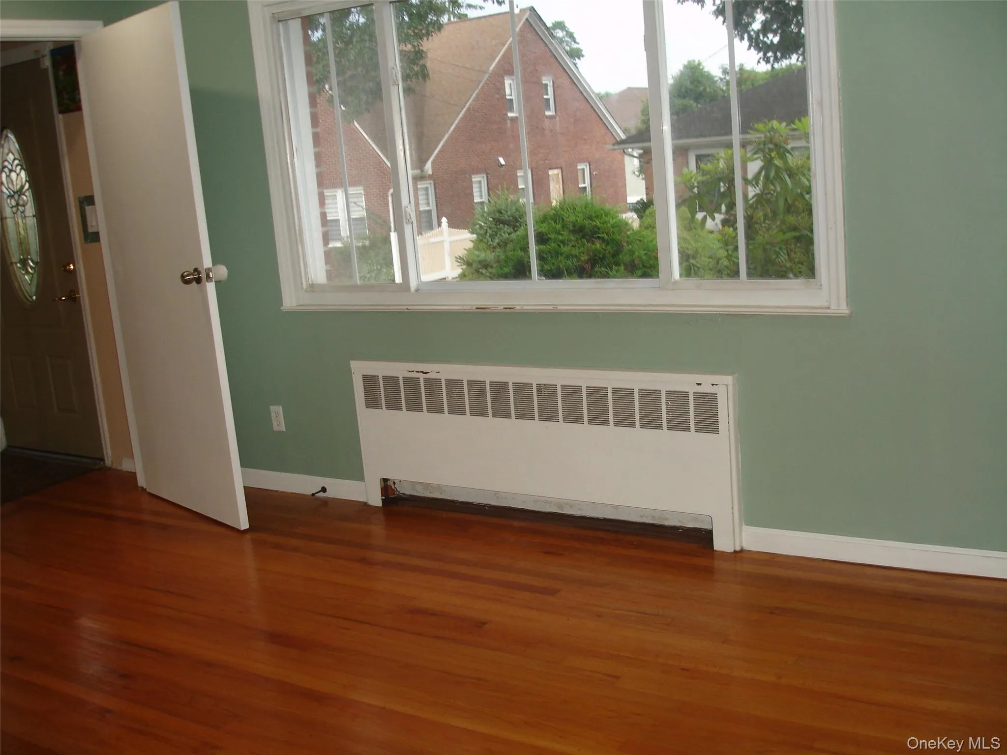 Entryway with radiator and wood finished floors Entryway with radiator and wood finished floors