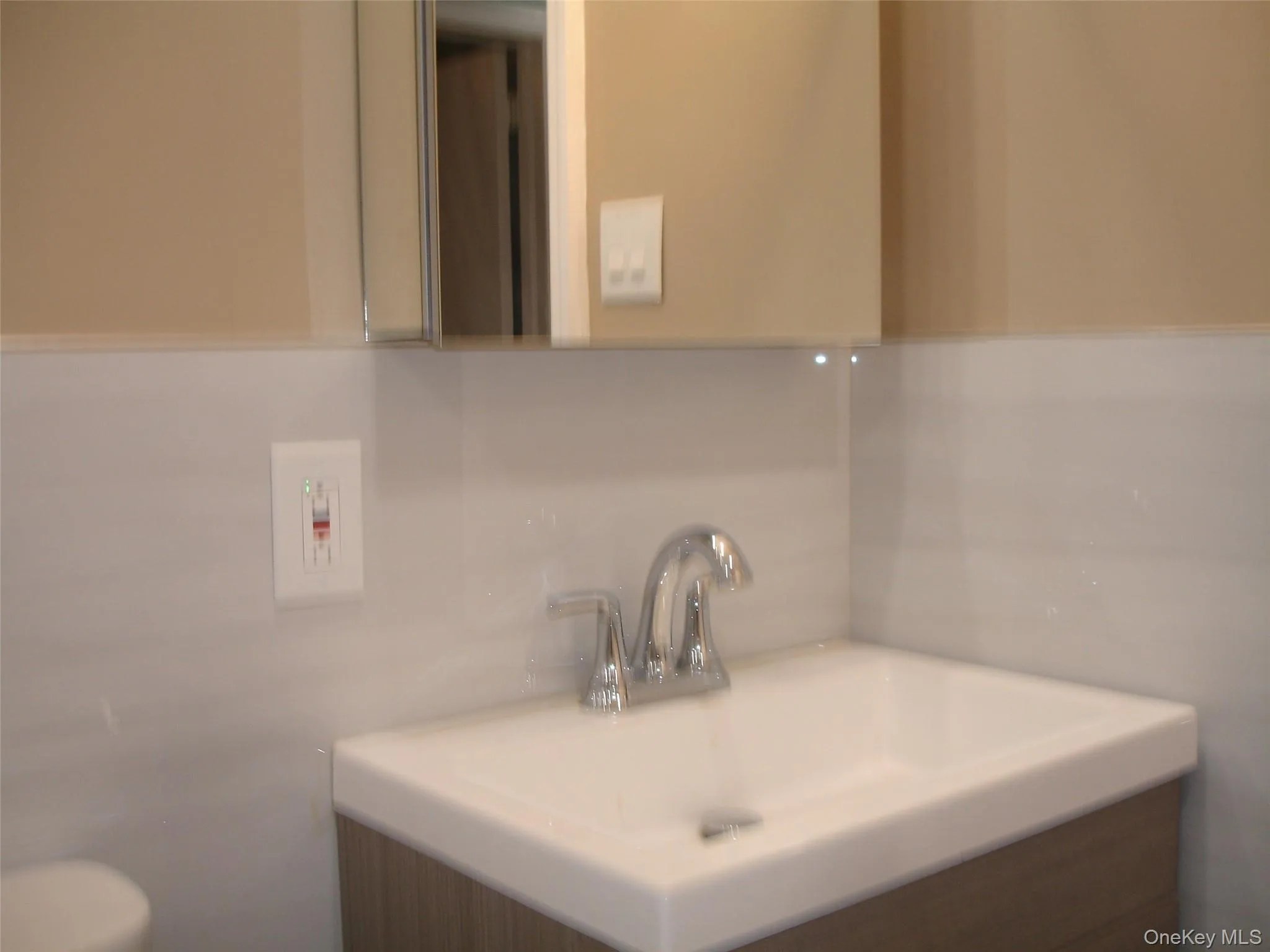 Half bathroom with vanity and toilet Half bathroom with vanity and toilet