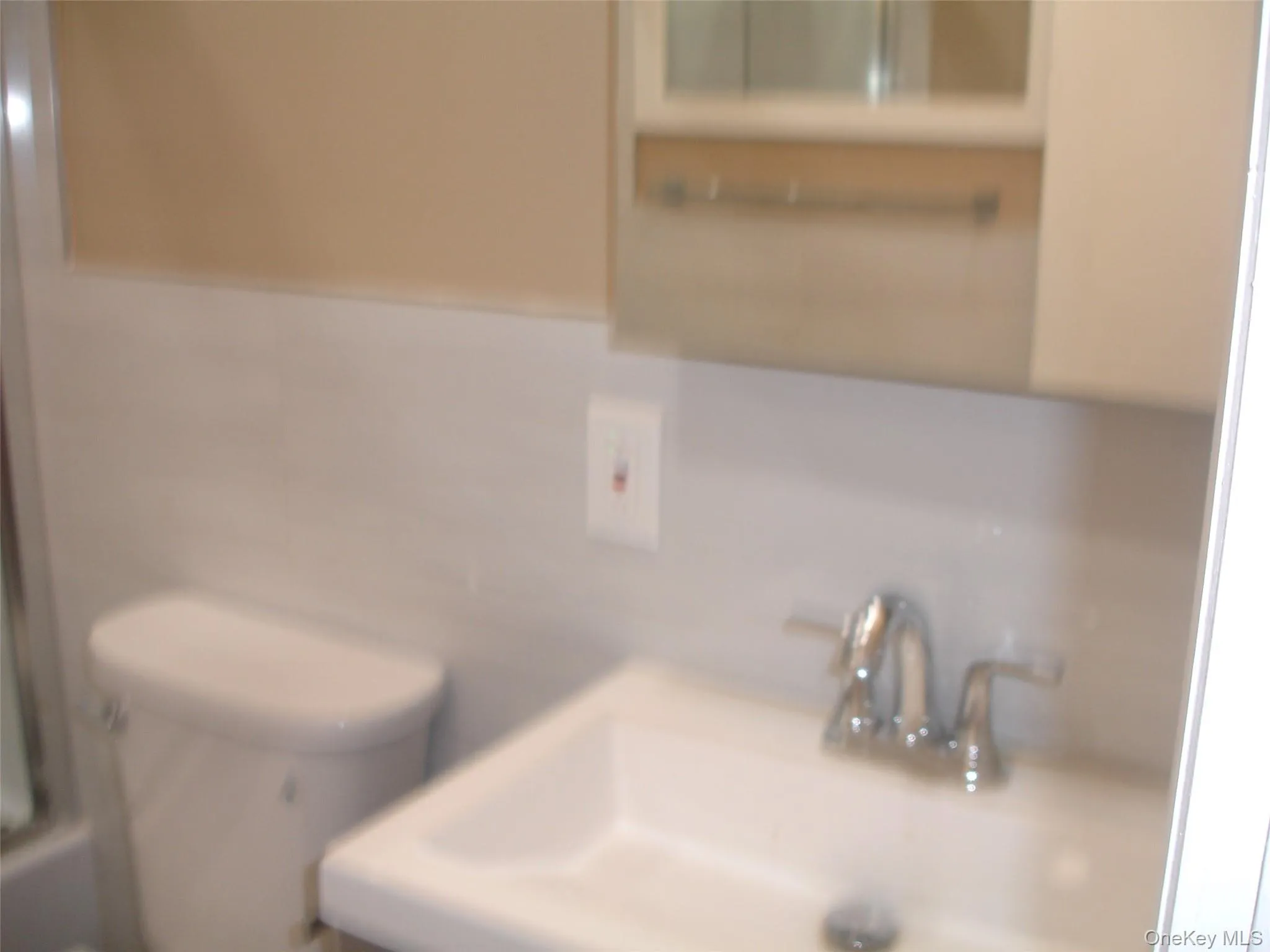 Bathroom view of tile walls and decorative backsplash Bathroom view of tile walls and decorative backsplash