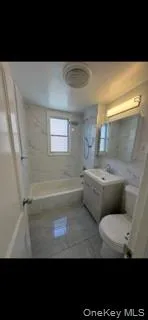 Bathroom with shower / bath combination and vanity Bathroom with shower / bath combination and vanity
