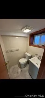 Bathroom featuring vanity and toilet Bathroom featuring vanity and toilet