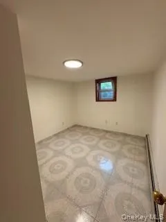 Unfurnished room featuring baseboard heating Unfurnished room featuring baseboard heating