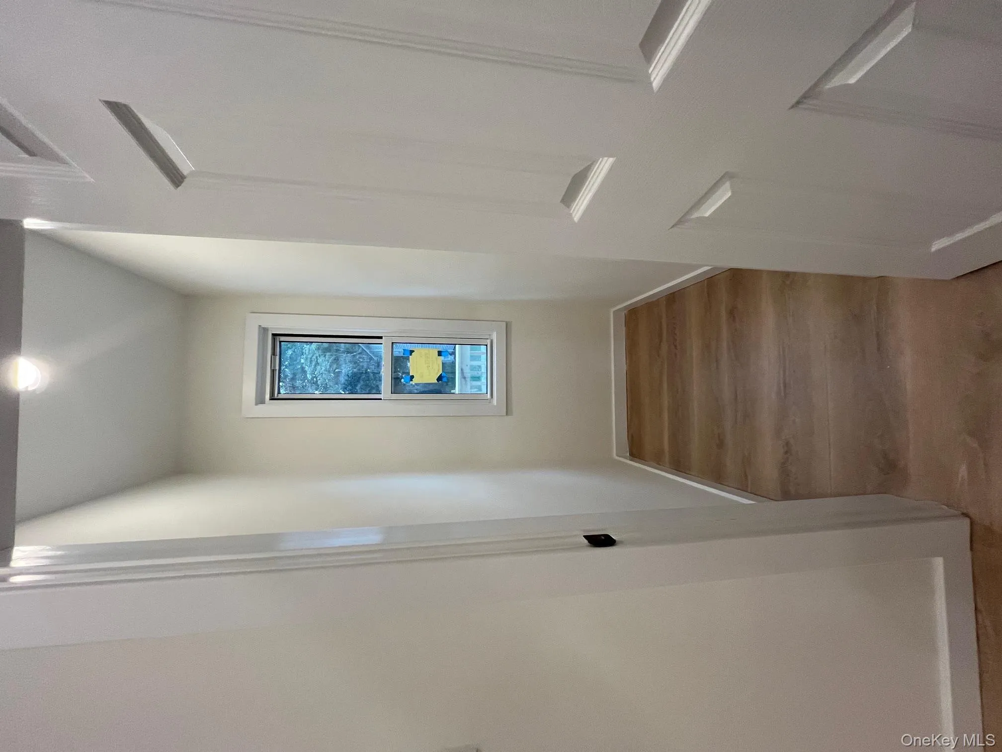 Hall featuring light wood-style floors and baseboards Hall featuring light wood-style floors and baseboards