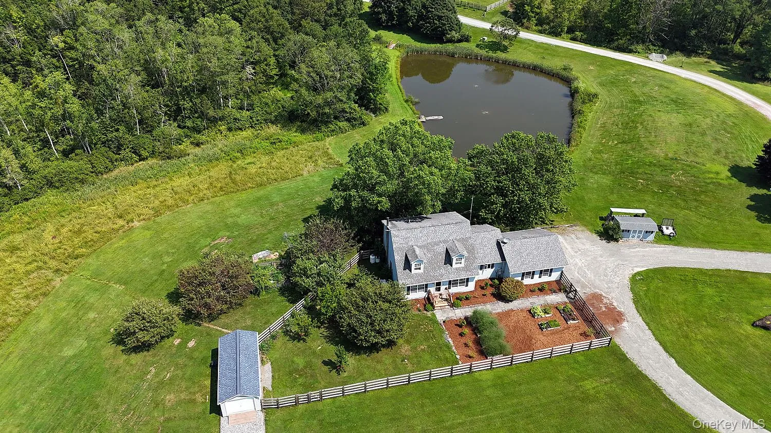 View from above of property with a large body of water View from above of property with a large body of water