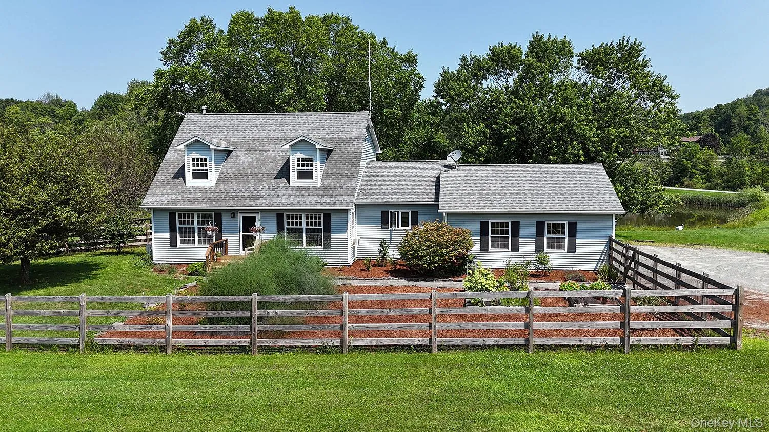 Cape cod home with a shingled roof Cape cod home with a shingled roof
