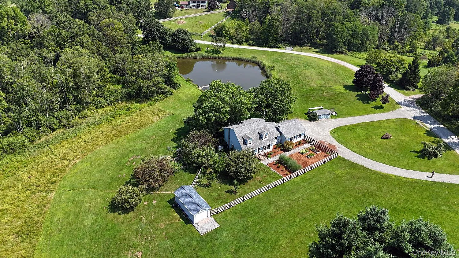 Aerial view of property and surrounding area with a large body of water Aerial view of property and surrounding area with a large body of water
