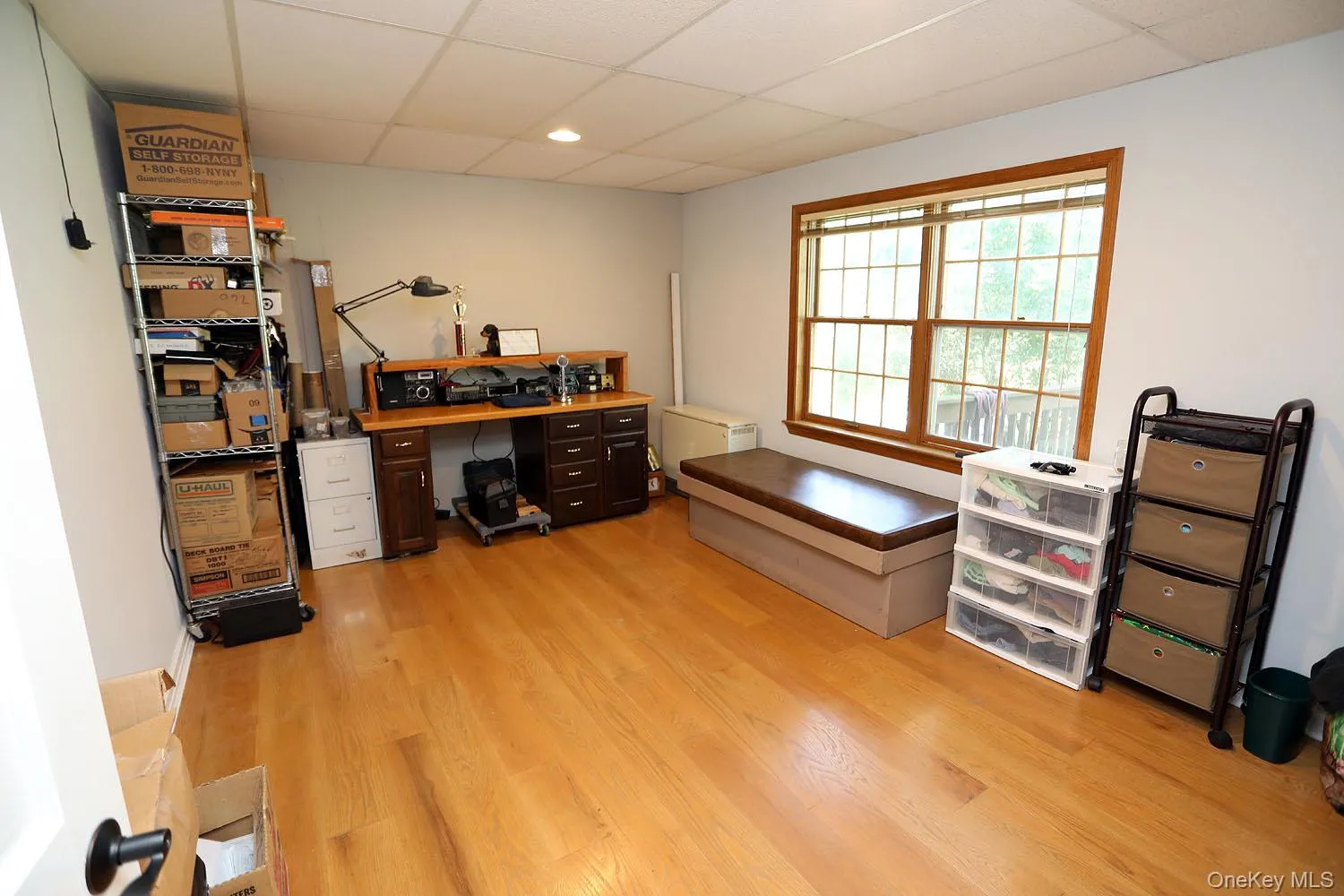 First floor Bedroom used as Office area featuring a paneled ceiling, light wood-style flooring, and recessed lighting First floor Bedroom used as Office area featuring a paneled ceiling, light wood-style flooring, and recessed lighting