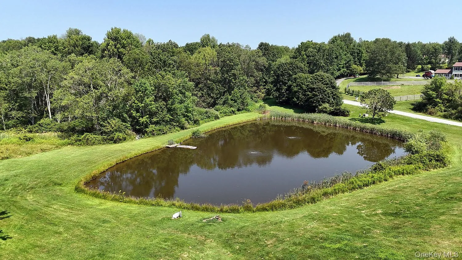 Water view featuring a heavily wooded area Water view featuring a heavily wooded area