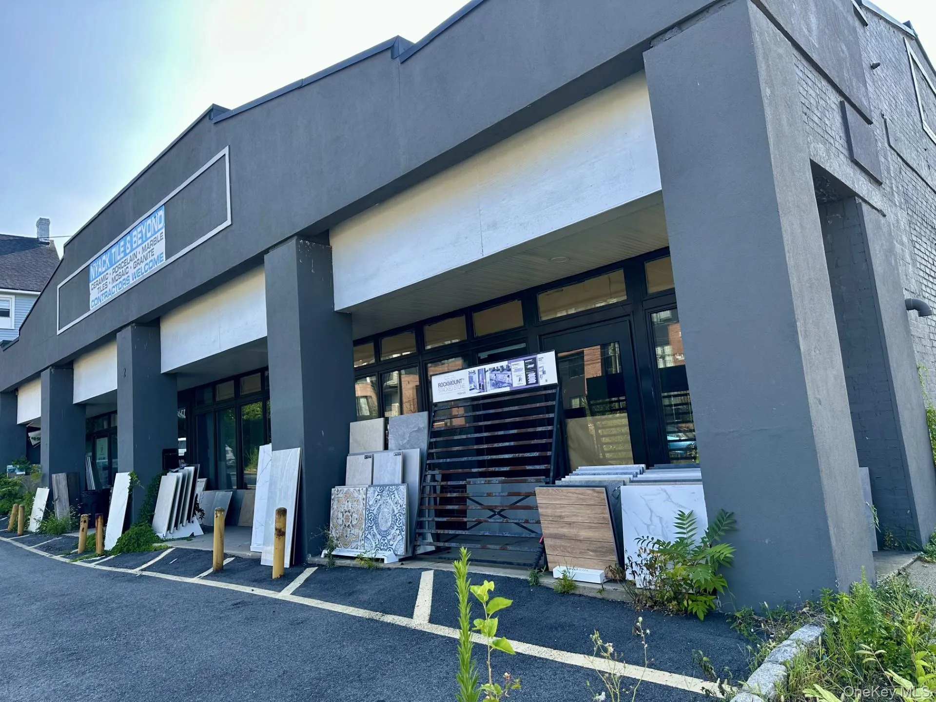 View of property featuring uncovered parking View of property featuring uncovered parking