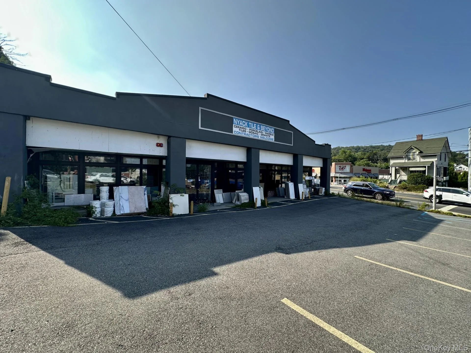 View of building exterior with uncovered parking View of building exterior with uncovered parking
