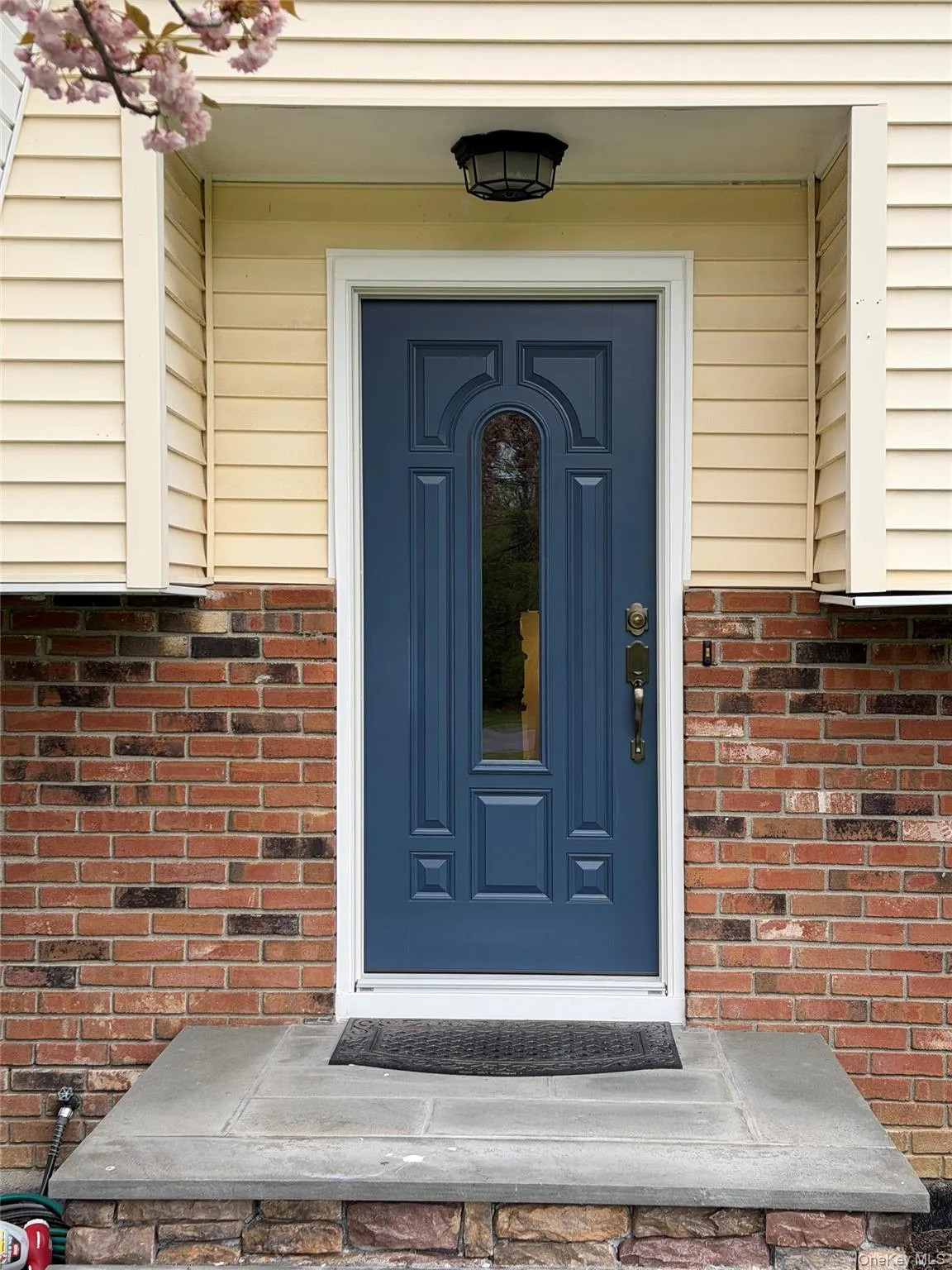 New steel and glass entry door with updated lock and handle set. New steel and glass entry door with updated lock and handle set.