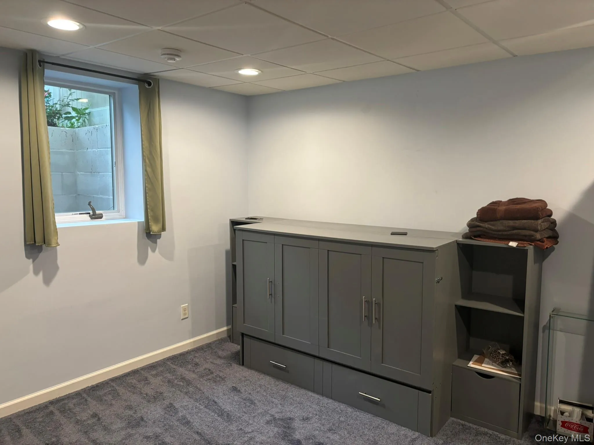 Miscellaneous room with dark carpet, a drop ceiling, and recessed lighting Miscellaneous room with dark carpet, a drop ceiling, and recessed lighting
