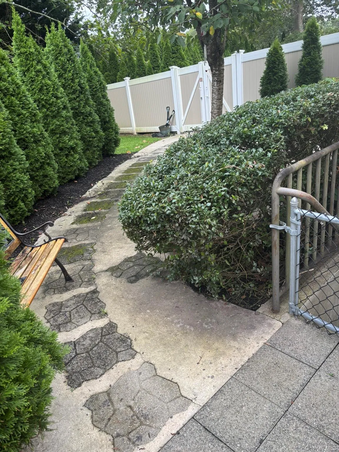 View of yard featuring a gate View of yard featuring a gate