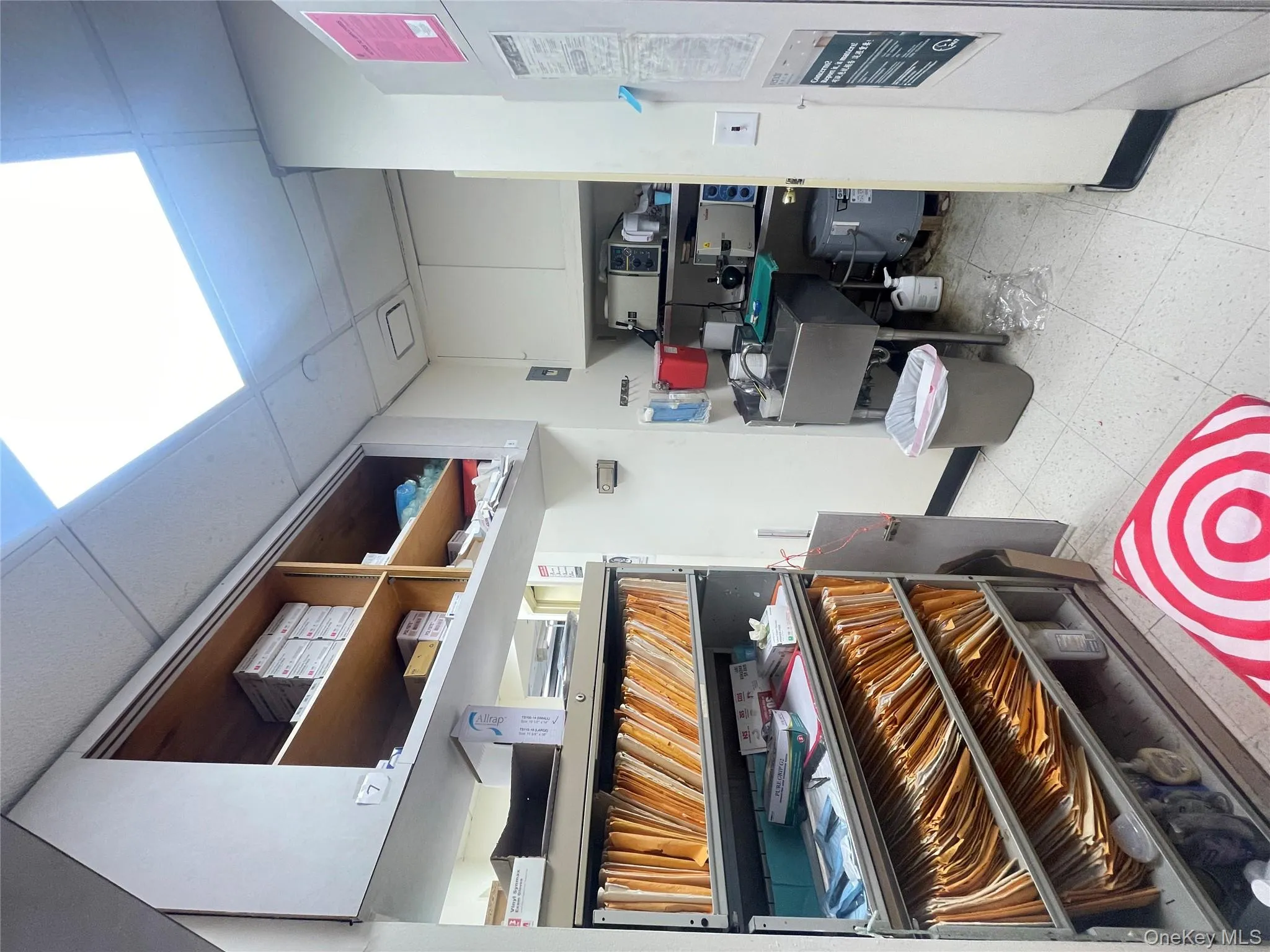 Storage room featuring water heater and a heating unit Storage room featuring water heater and a heating unit