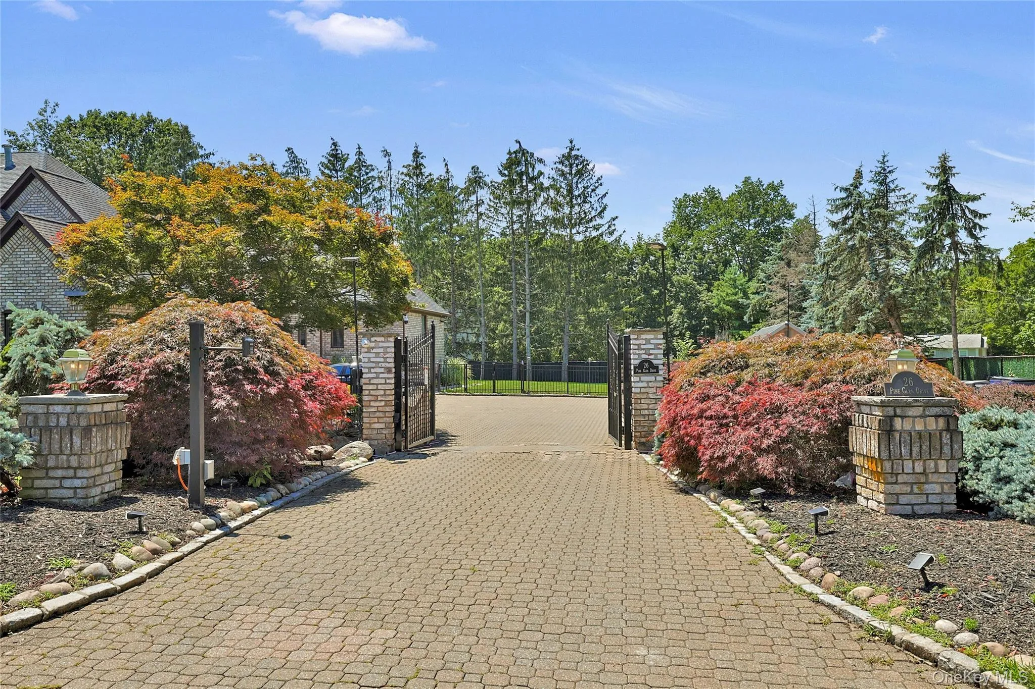 View of property with a gate View of property with a gate