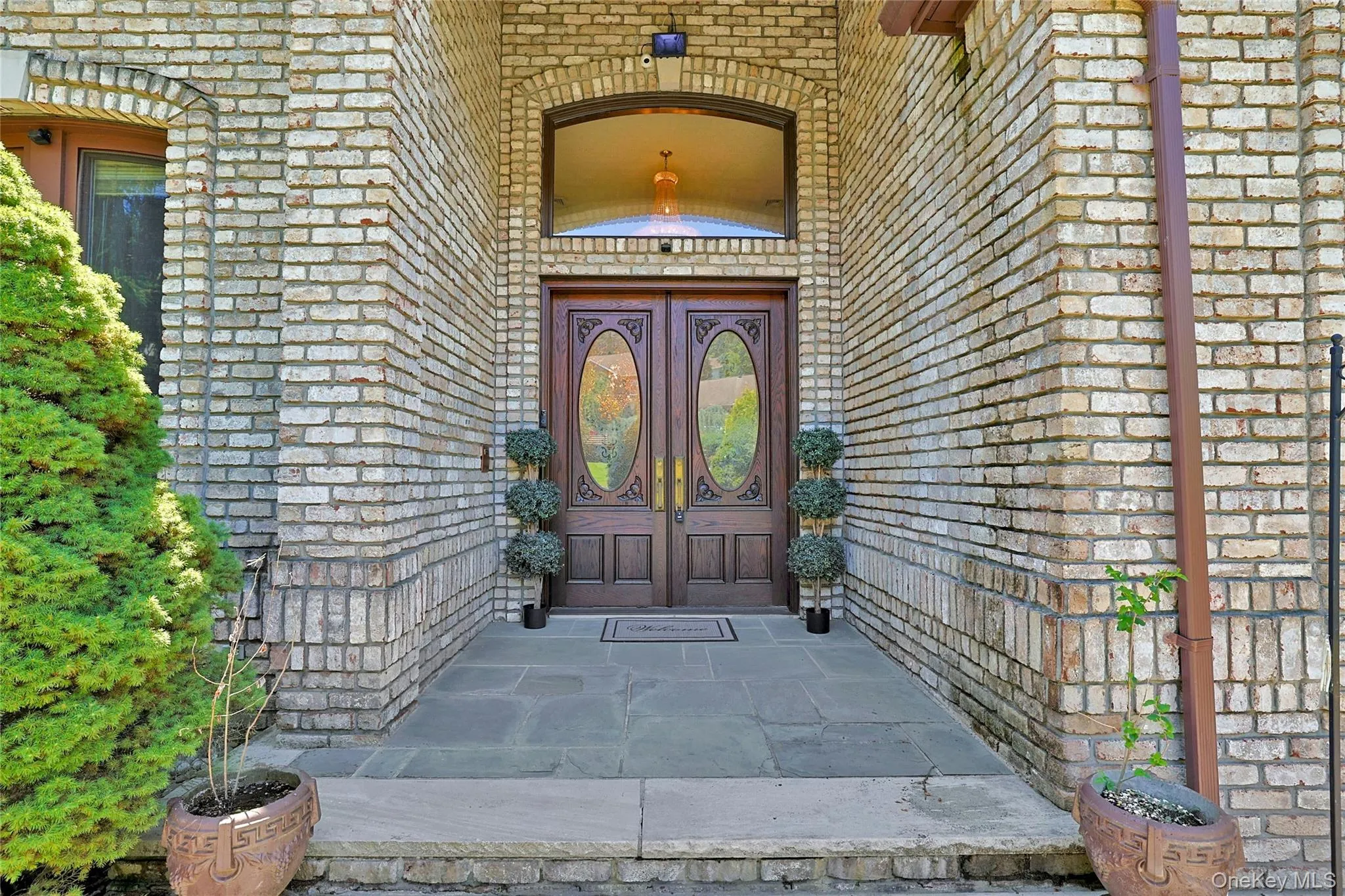 View of exterior entry with brick siding and french doors View of exterior entry with brick siding and french doors