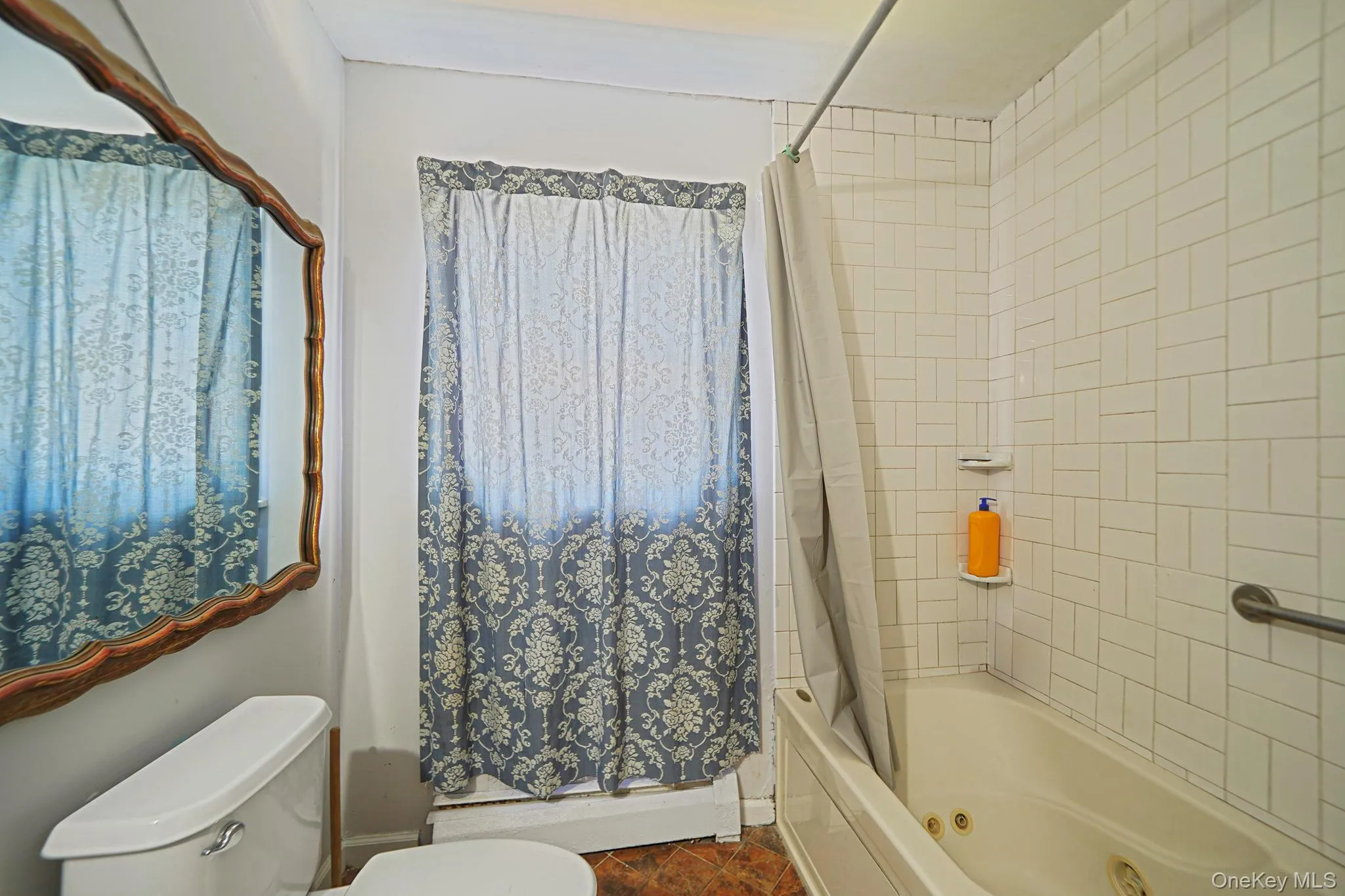 Hall Full bathroom with toilet and a combined bath / shower with jetted tub Hall Full bathroom with toilet and a combined bath / shower with jetted tub