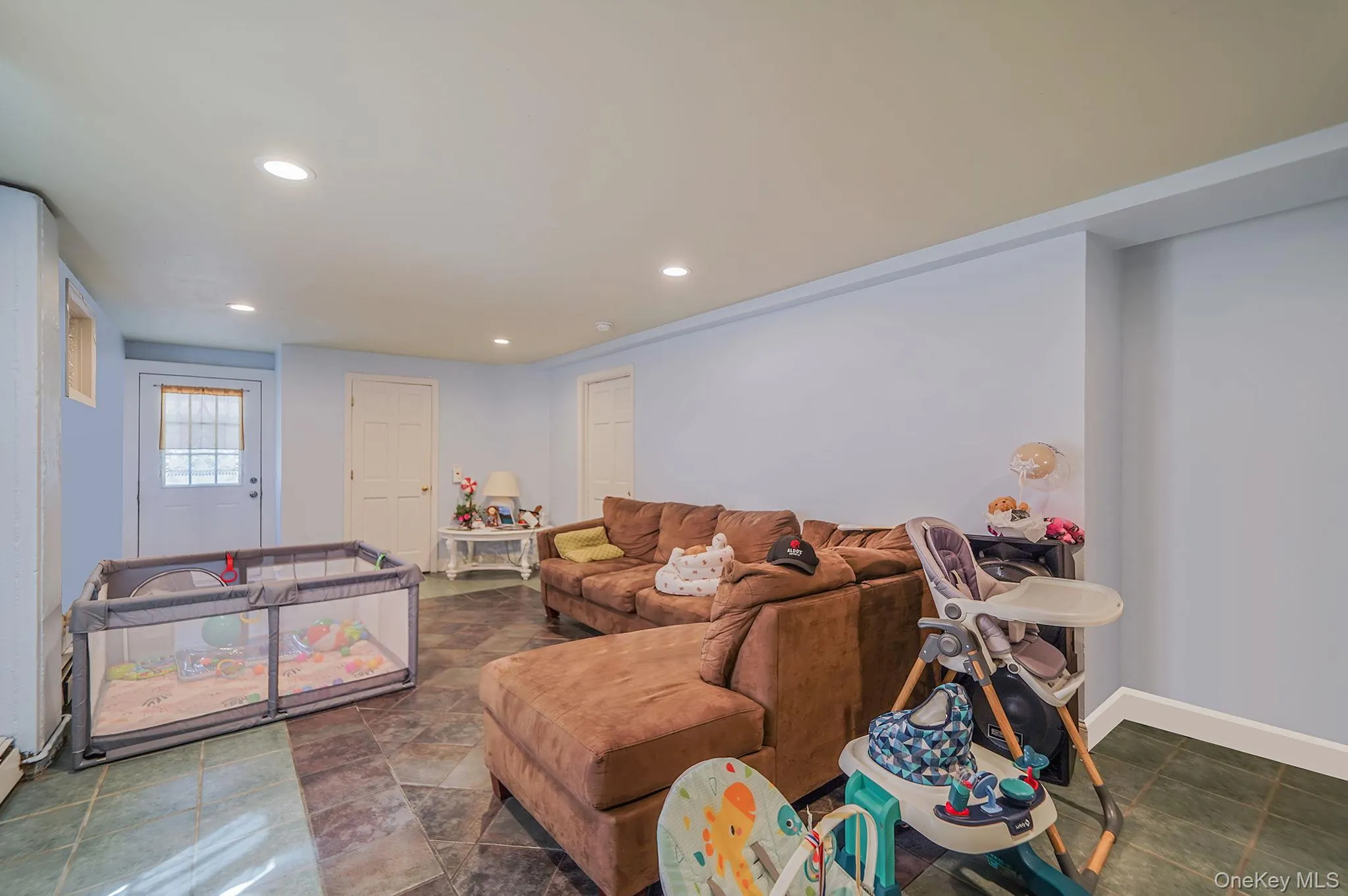 Lower level living area featuring recessed lighting Lower level living area featuring recessed lighting