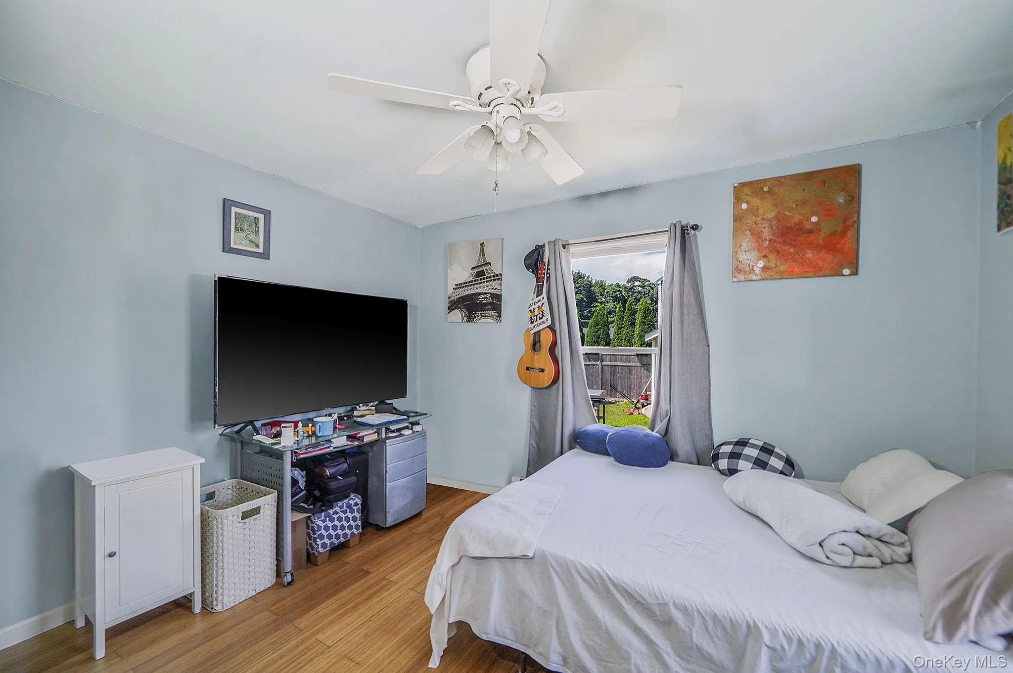 Primary Bedroom with wood finished floors and a ceiling fan Primary Bedroom with wood finished floors and a ceiling fan