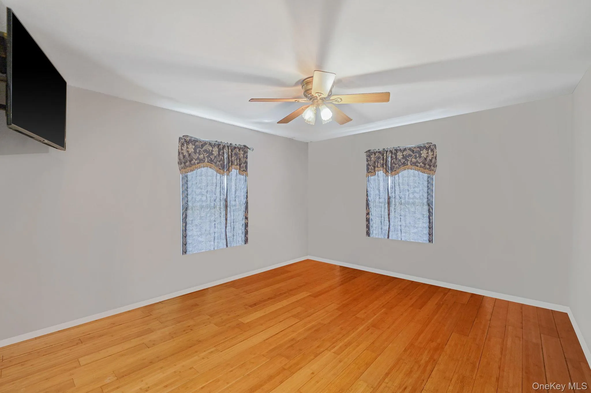 Bedroom w/ light wood finished floors Bedroom w/ light wood finished floors