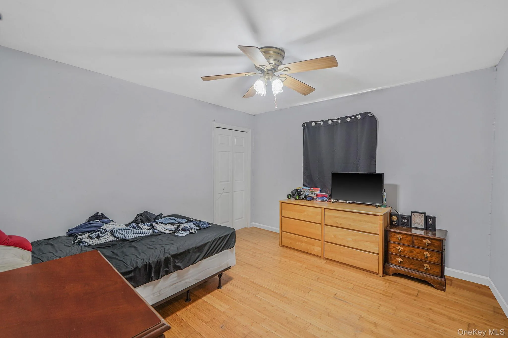 2nd Bedroom with light wood-style flooring, closet and ceiling fan 2nd Bedroom with light wood-style flooring, closet and ceiling fan