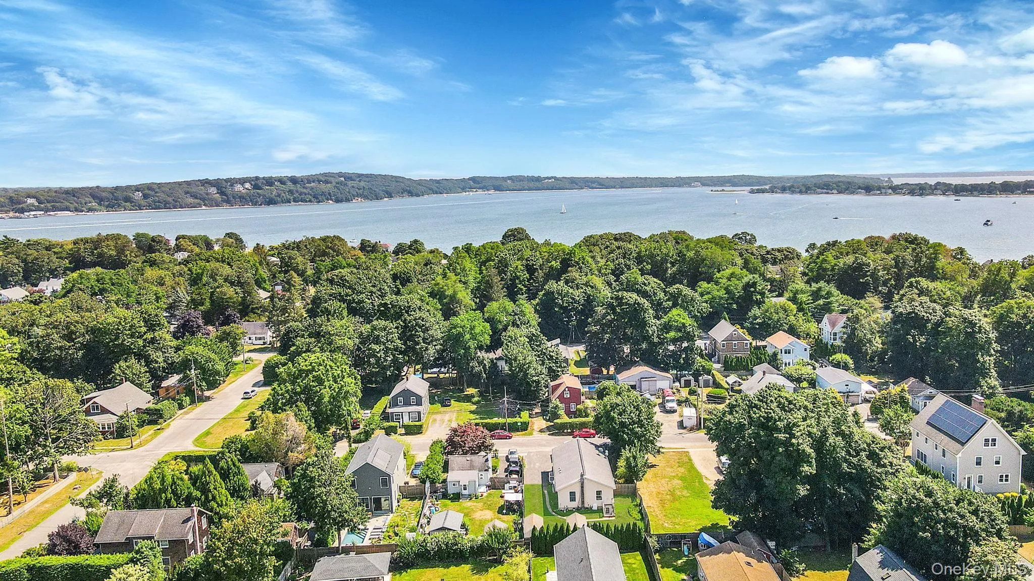 Aerial perspective of suburban area featuring nearby "Pipes Cove" & "Greenport Harbor" Aerial perspective of suburban area featuring nearby "Pipes Cove" & "Greenport Harbor"
