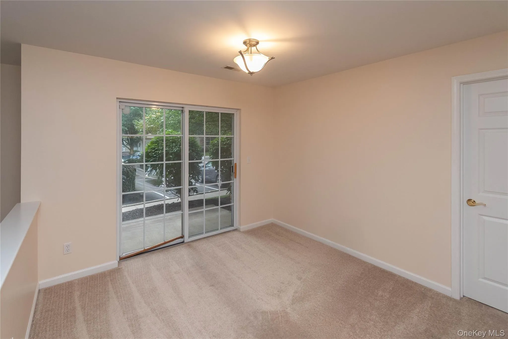 Unfurnished dining area featuring carpet floors and baseboards Unfurnished dining area featuring carpet floors and baseboards