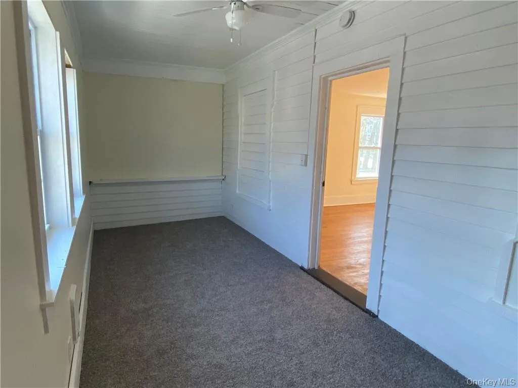 Front bedroom with two new windows, electric heater, and fresh carpeting. Front bedroom with two new windows, electric heater, and fresh carpeting.