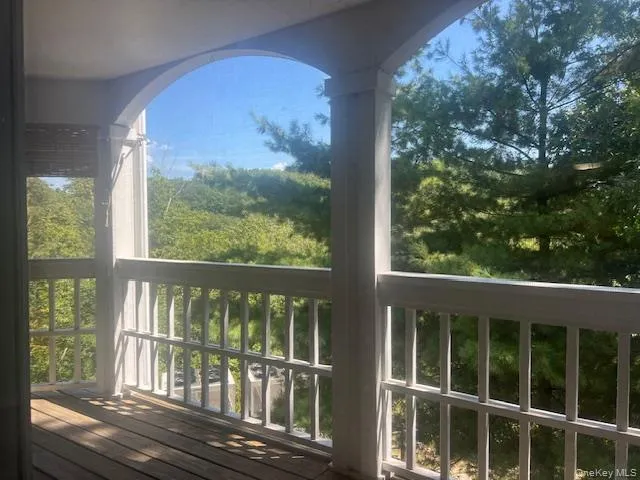 Wooden deck with a sunroom Wooden deck with a sunroom