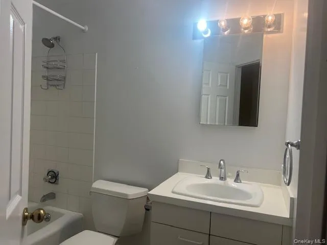 Bathroom featuring vanity and bathtub / shower combination Bathroom featuring vanity and bathtub / shower combination