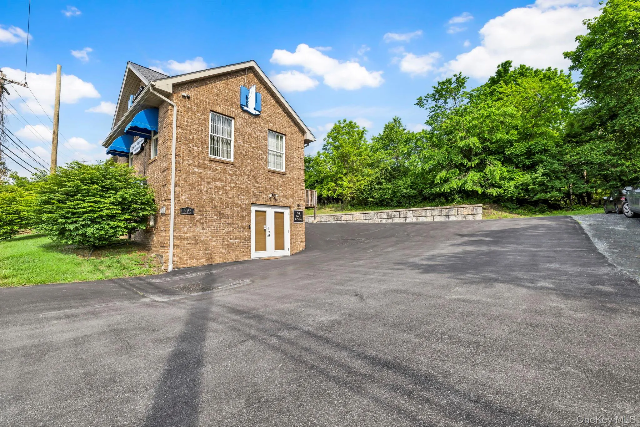 View of home\'s exterior featuring brick siding View of home\'s exterior featuring brick siding