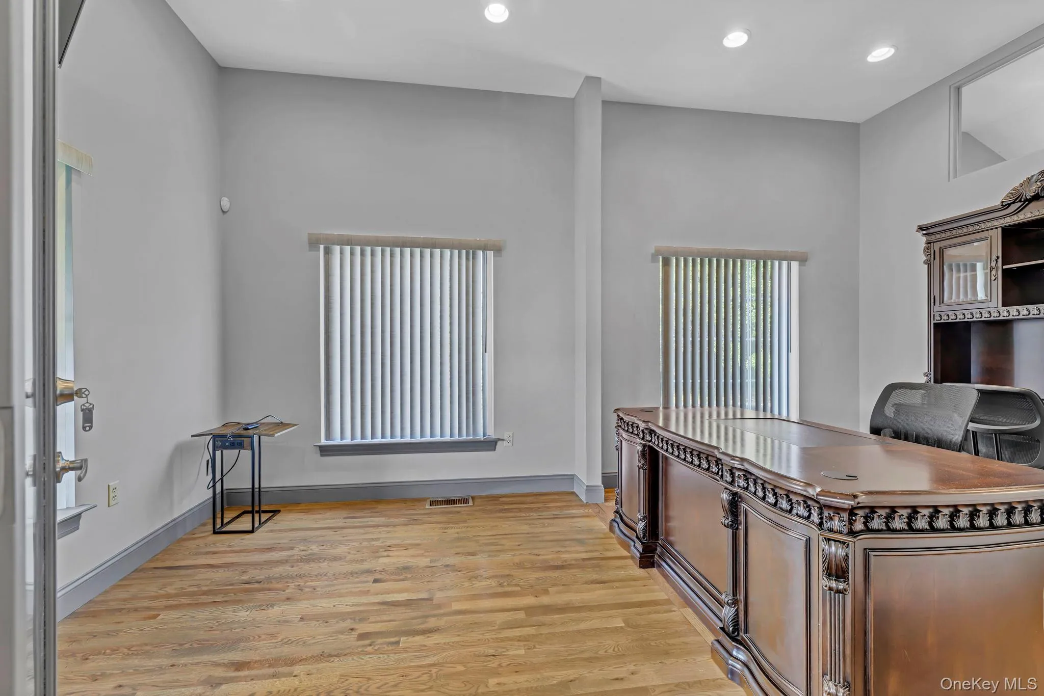 Home office featuring light wood-style floors, recessed lighting, and baseboards Home office featuring light wood-style floors, recessed lighting, and baseboards