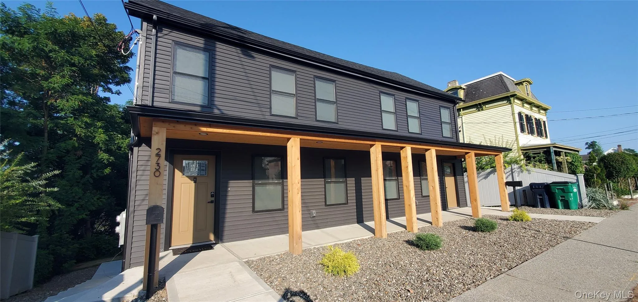 View of front of house with a porch and roof with shingles View of front of house with a porch and roof with shingles