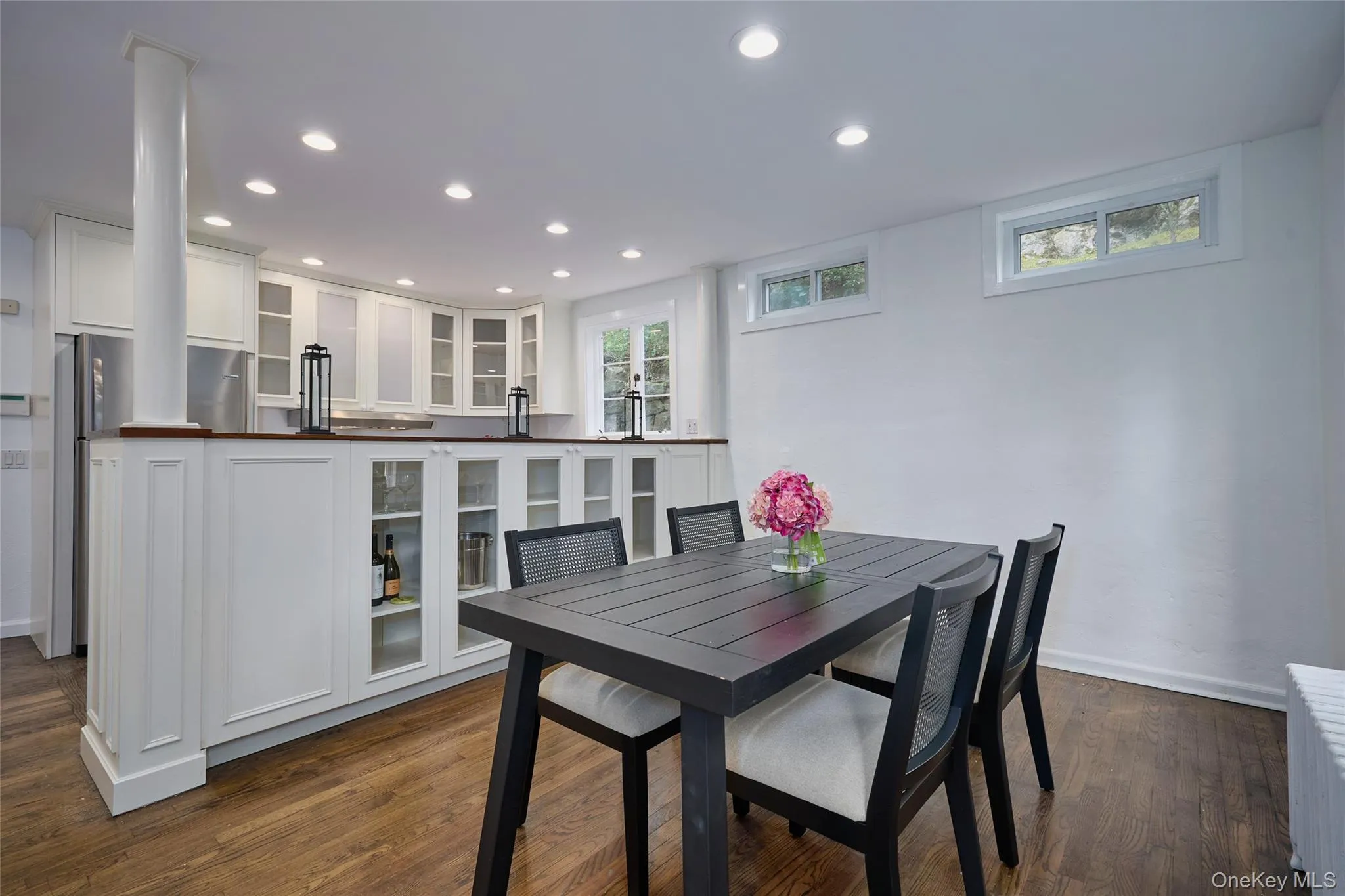 Dining room featuring recessed lighting, dark wood finished floors, and radiator Dining room featuring recessed lighting, dark wood finished floors, and radiator