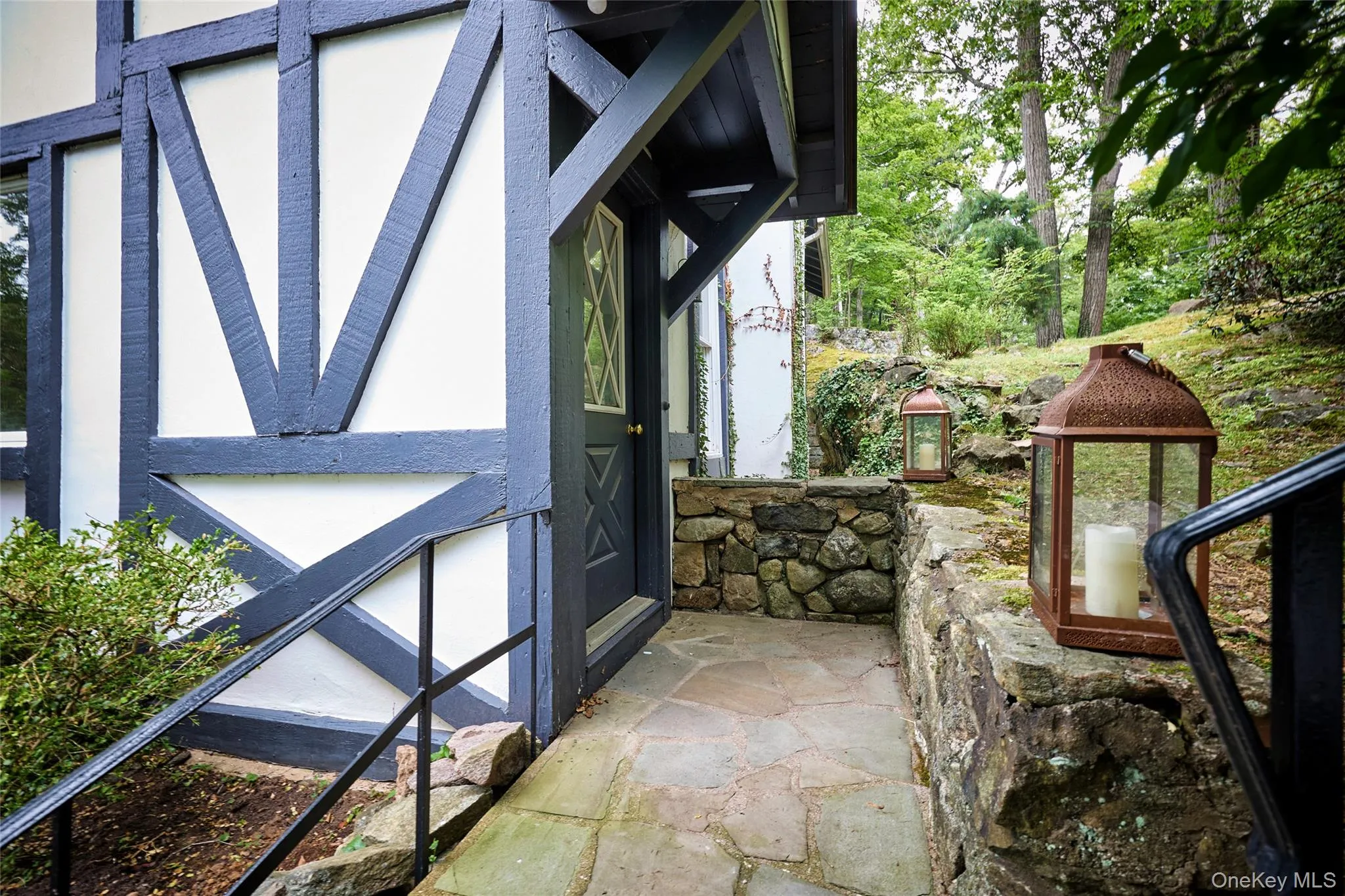 Entrance to property featuring stucco siding Entrance to property featuring stucco siding