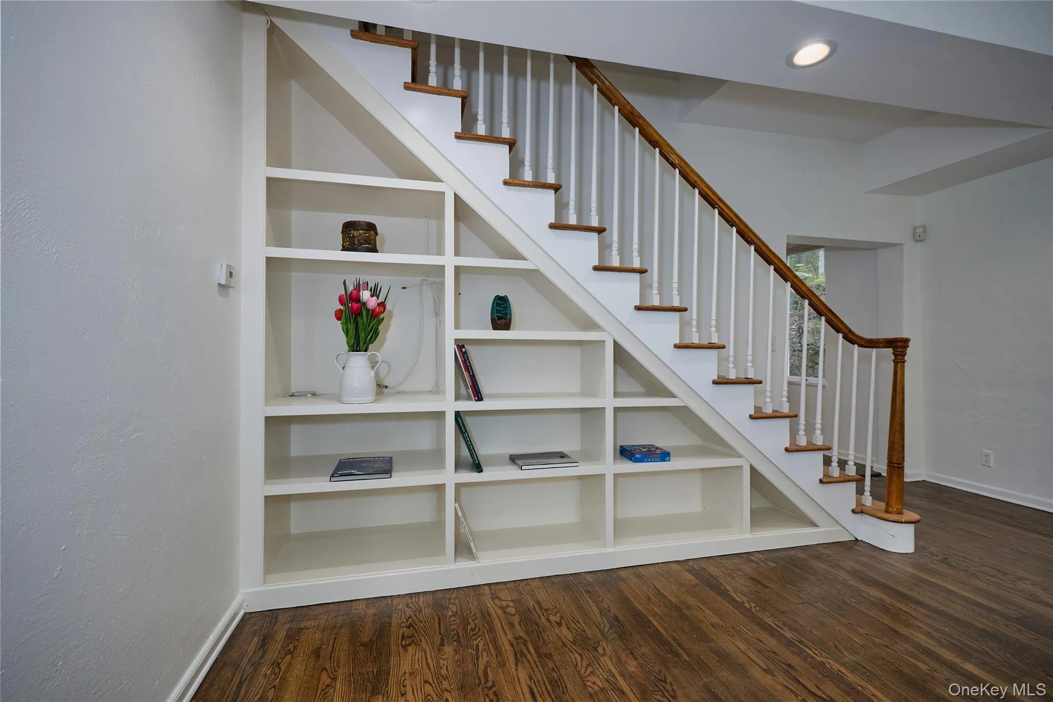Stairway with wood finished floors and recessed lighting Stairway with wood finished floors and recessed lighting