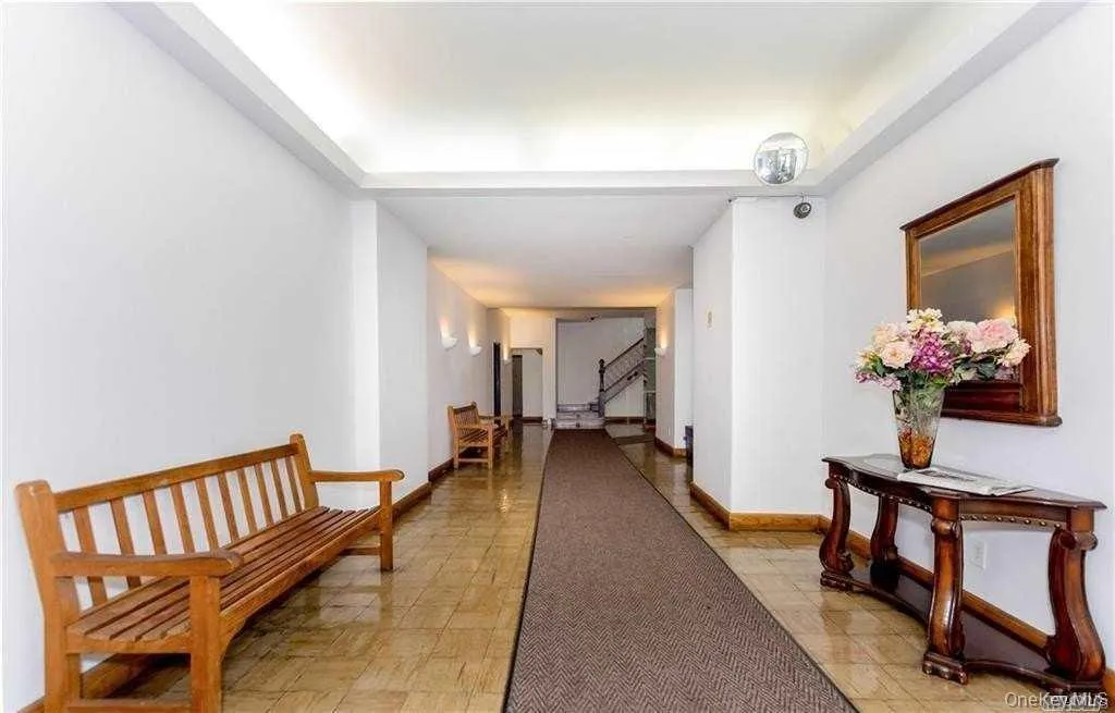 Hallway with baseboards and stairway Hallway with baseboards and stairway