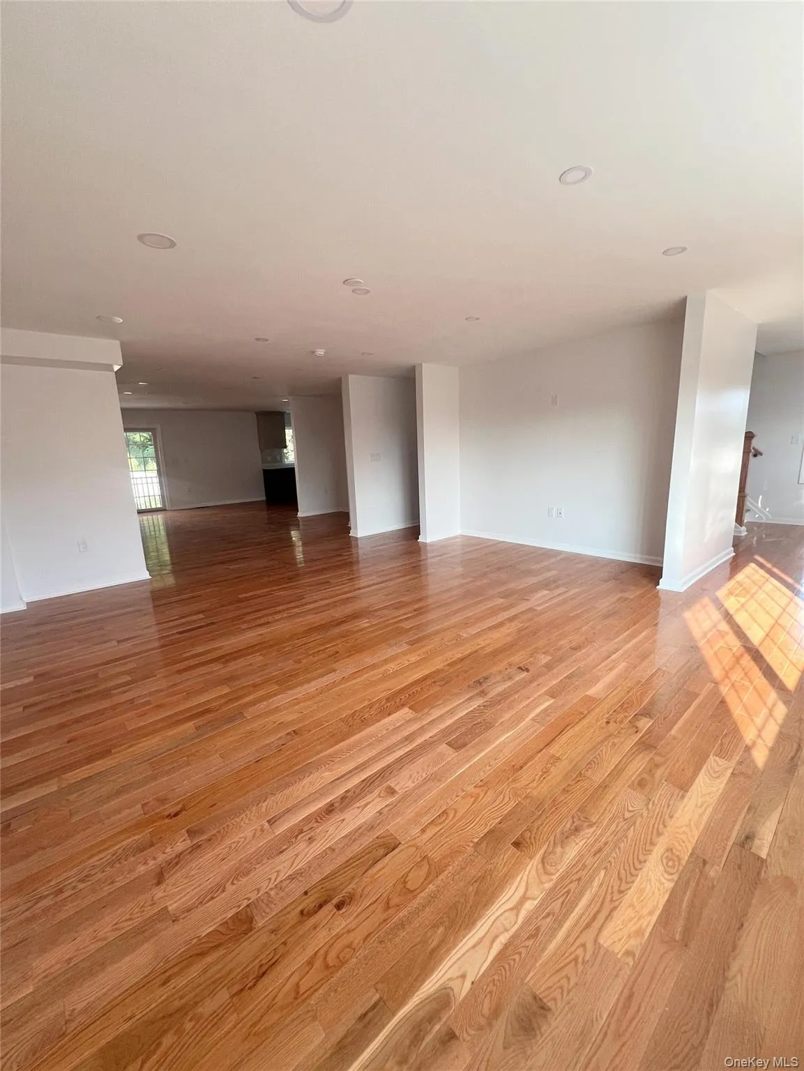Unfurnished room with light wood finished floors and recessed lighting Unfurnished room with light wood finished floors and recessed lighting
