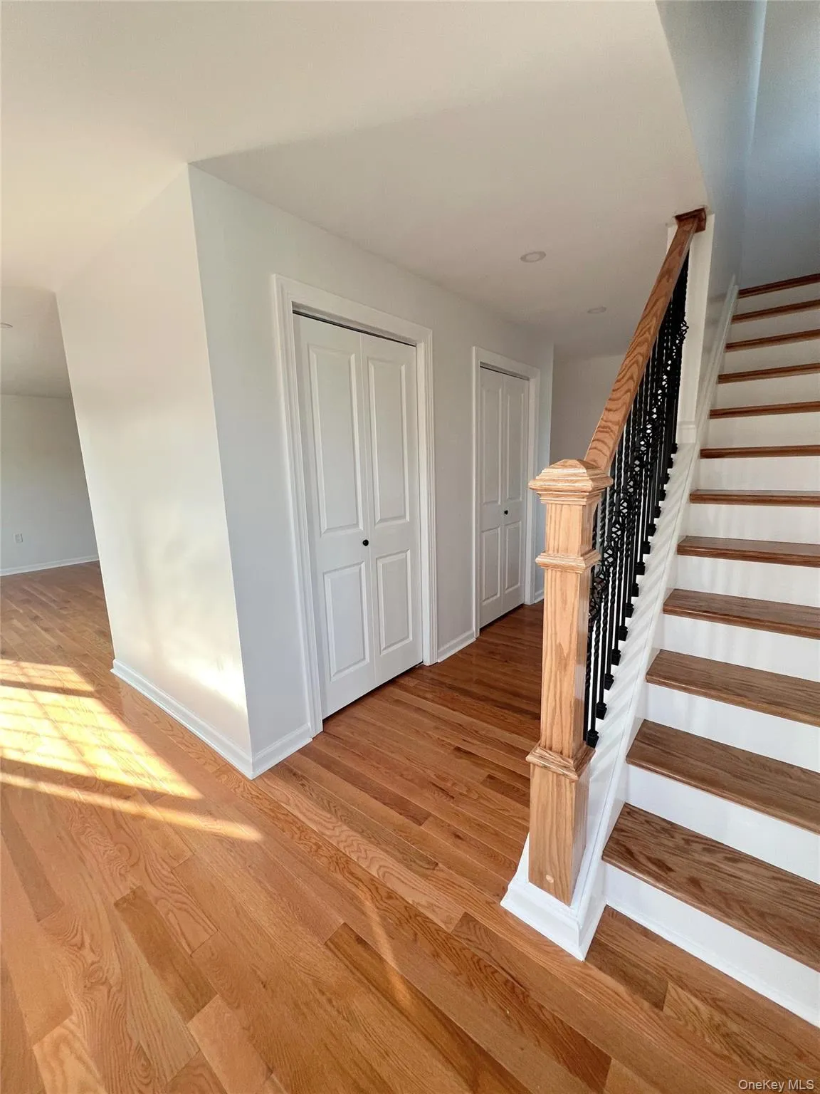 Stairway with wood finished floors and baseboards Stairway with wood finished floors and baseboards