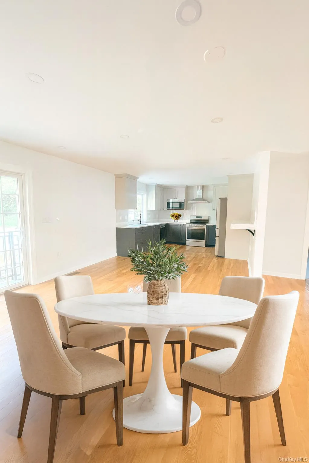 Dining area featuring light wood-type flooring and plenty of natural light Dining area featuring light wood-type flooring and plenty of natural light