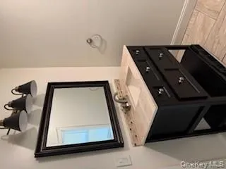 Bathroom featuring vanity and baseboards Bathroom featuring vanity and baseboards