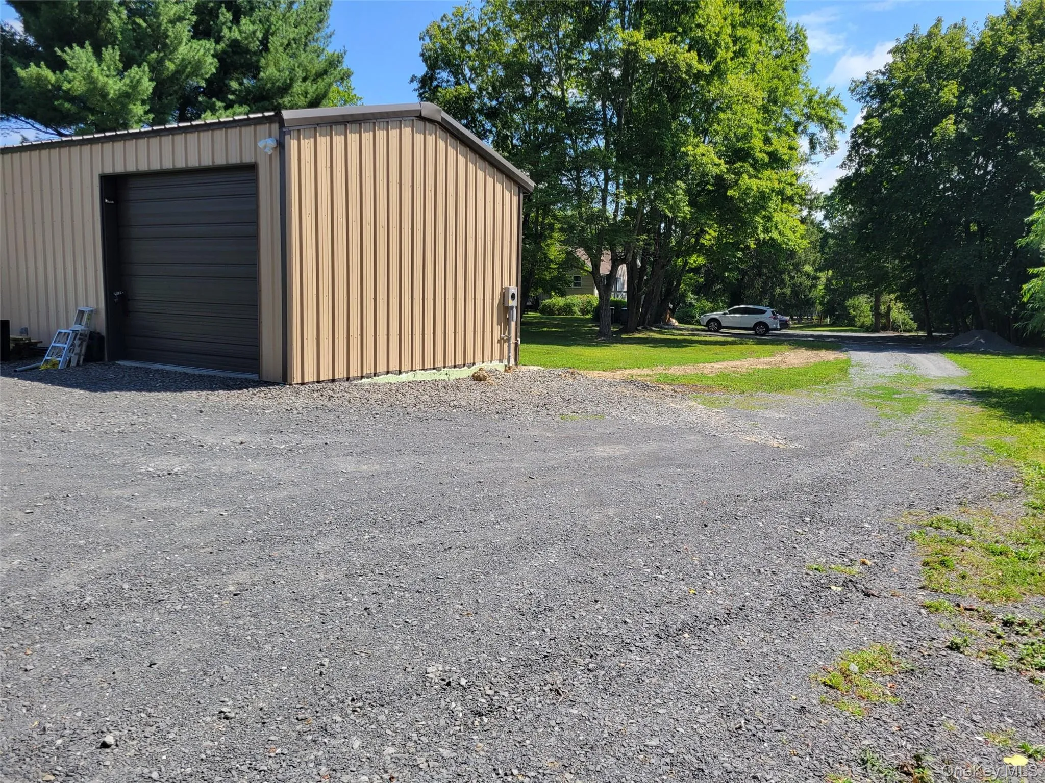 Detached garage with gravel driveway Detached garage with gravel driveway