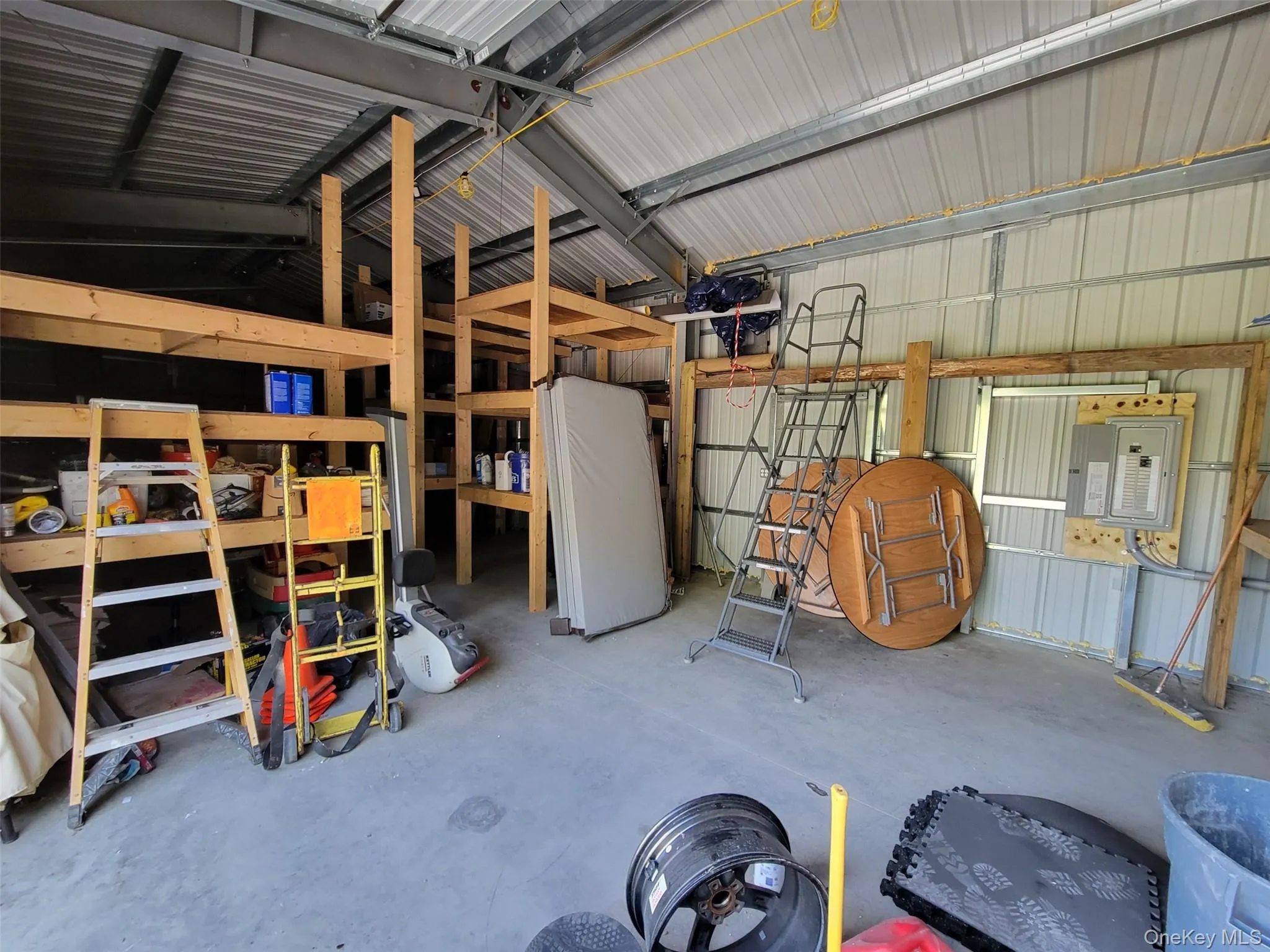 Garage with metal wall and white refrigerator Garage with metal wall and white refrigerator