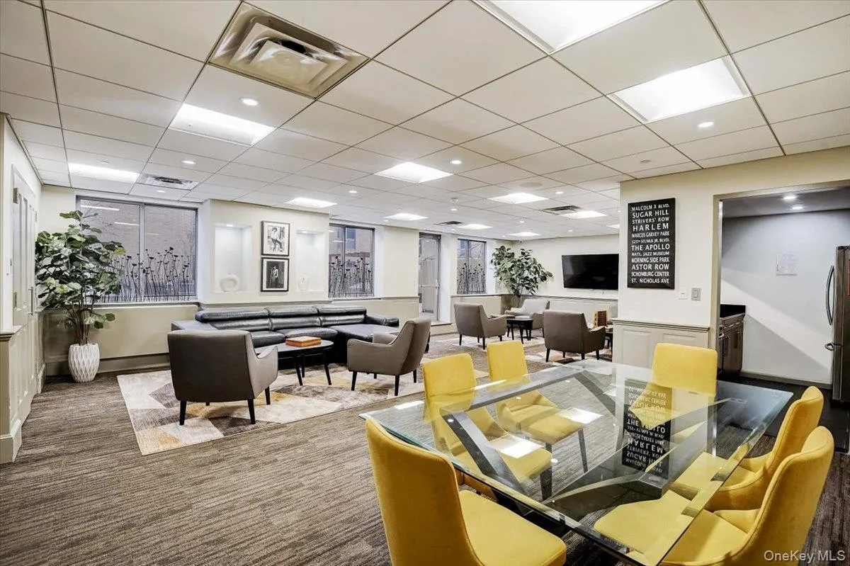 Building lobby featuring a drop ceiling Building lobby featuring a drop ceiling