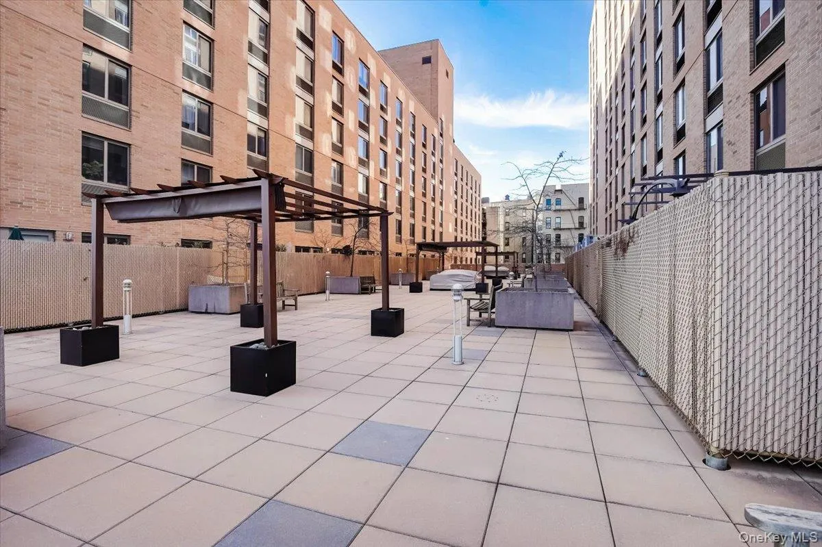 Surrounding community with a patio area and a pergola Surrounding community with a patio area and a pergola